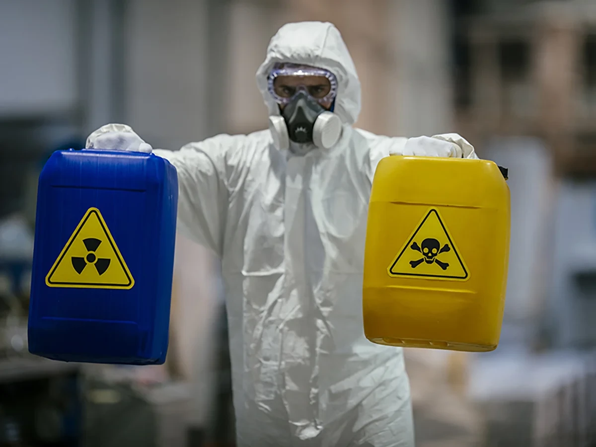 Biohazard cleanup technicians in protective equipment at a remediation scene in Naples, FL